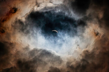 seconds before total Solar Eclipse seen through the clouds  Hamilton, Ontario, Canada, April 8th,...