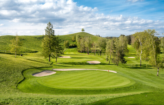 Golf and country club in Schonenberg, Hirzel, Switzerland. Drumlin hill with a lonely tree
