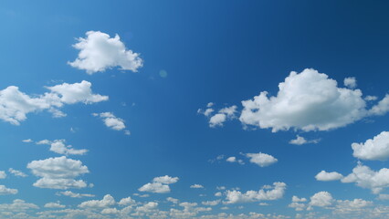 Blue heaven summer cloudscape. Rolling puffy white clouds are moving. Time lapse.