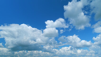 Blue sky with copyspace background with forming clouds in Summer day outdoors. Time lapse.