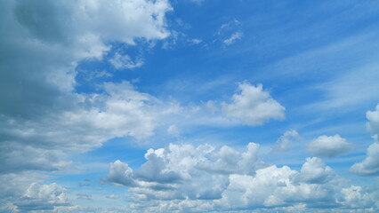 Fluffy layered clouds sky atmosphere. Majestic amazing blue sky with clouds. White and blue colors....