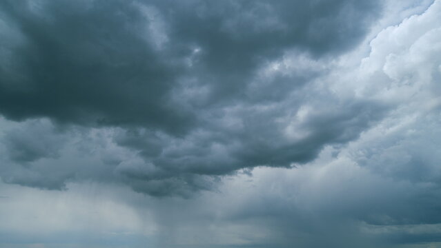 Gray rainy clouds float across dark sky. B roll sky and dark cloud. Nature environment dark huge cloud sky. Timelapse.