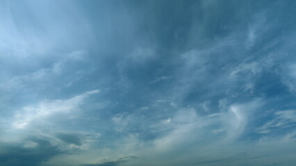 Soft white clouds moving on blue sky background. Tropical summer or spring sunlight. Daytime....