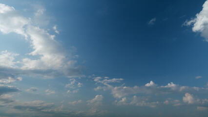 Cloud stratocumulus nature background. Blue sky with cumulus clouds and sun. Nature background of...