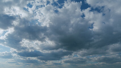 Sky with bautiful silky clouds. Puffy fluffy stratocumulus and stratus clouds. Timelapse.