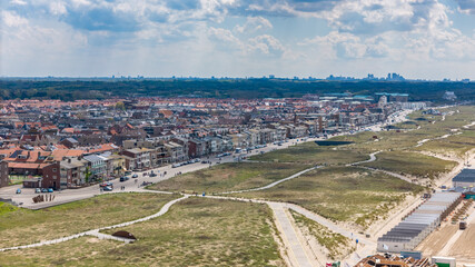 Aerial drone photo of the coastal town Katwijk with a beach and boulevard.