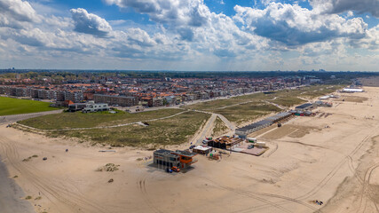Aerial drone photo of the coastal town Katwijk with a beach and boulevard.