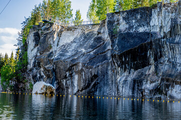 marble canyon with marble rocks and mountains in the mountain park of Karelia in Russia with a...
