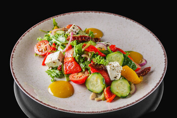 salad with baked bell peppers tomatoes cucumber red onion and feta cheese