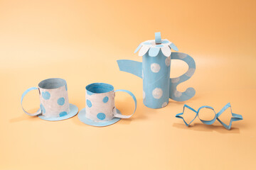 Coloring craft for kids, surreal tea party scene with paper modeling art featuring a couple of cups...