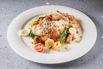 delicious fresh caesar salad with chicken cherry tomatoes and quail eggs