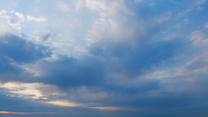 Clouds in different shades. Clouds during sunset. Panoramic view. Timelapse.