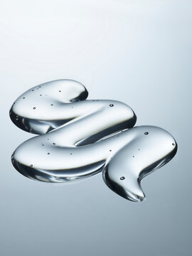 texture cosm&eacute;tique transparent en gel sur fond neutre