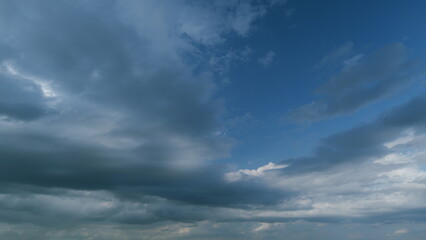 Black moving storm clouds thunderstorms on horizon. Thunderstorm in tropical summer with scary and...