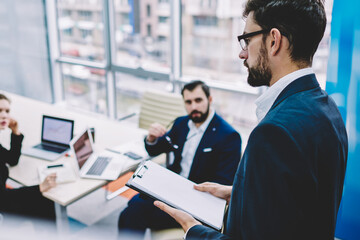 Main owner of computer company collect meeting with two vice-presidents for discussing few problems, successful  professionals talking about company and makes decisions on  productive meeting