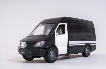 Fototapeta na wymiar Toy plastic model of a bus on a white background.