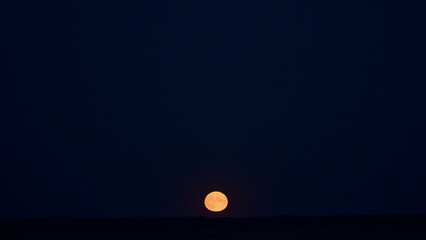 Full moon at night. Mystery fairyland scene. Details on surface visible. Timelapse.