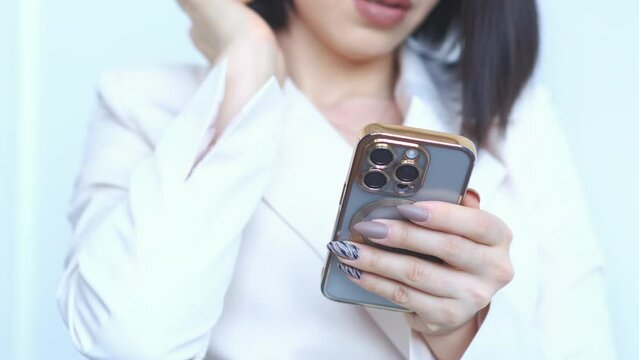 Woman is holding iphone15 pro on white background.