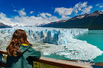 girl looking at the glacial landscape of Perito Moreno in Pampa Argentina