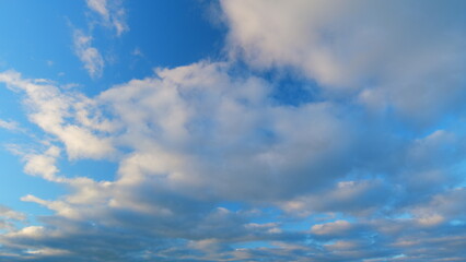 Intense dramatic panoramic sunset. Abstract different shades clouds at sunset sky background....