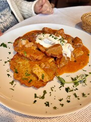 potato pancakes, goulash pancakes, fresh cream, dinner plate