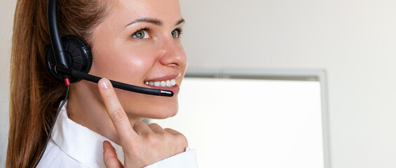 Woman office worker in headset. Customer service or hotline representative. Helpdesk.