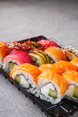 set of delicious fresh sushi roll with salmon avocado cucumber tuna eel Philadelphia cheese