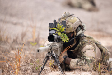 Military soldier sniper shooter aim assault rifle to the target