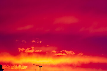 Fototapeta premium Beautiful bloody evening sky on a spring sunset with silhouette skyline of Swiss City of Zürich. Photo taken May 3rd, 2024, Zurich, Switzerland..