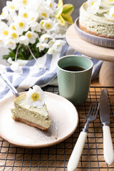 beautiful, appetizing mint cheesecake decorated with flowers