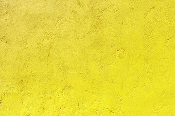 Texture of an old yellow plastered wall. Abstract construction background.