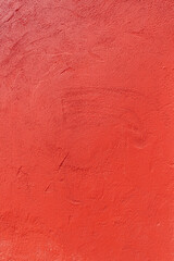 Texture of an old red plastered wall. Abstract construction background.