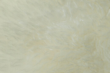 beige sheepskin texture with soft hairs, natural fur for the designer, the concept of processing, production of furrier products, stress relief, psychological stress