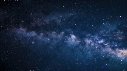 The image showcases a beautiful night sky dotted with stars and subtle nebula formations