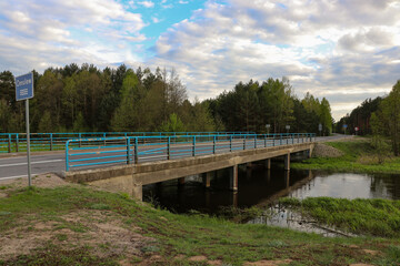 Fototapeta na wymiar Bridge over the charming Omulew River, Masovian Voivodeship, Poland