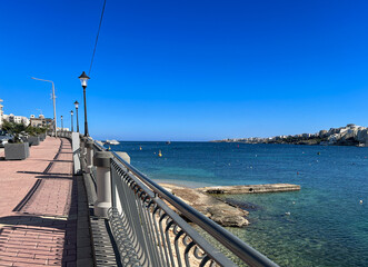 Panoramic view of the sea and the promenade in Bugibba, Malta