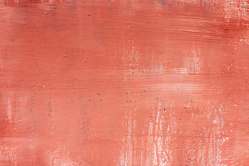 Absctract terracotta coloured wall background. Close-up view of stained painted textured concrete...
