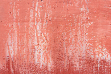 Absctract terracotta coloured wall background. Close-up view of stained painted textured concrete wall. Copy space for your text or decorations. Colorful construction material background theme.