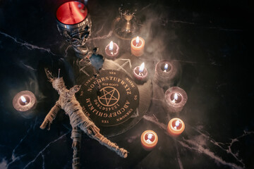 A chilling scene of an occult ritual featuring a voodoo doll pinned with needles, surrounded by...