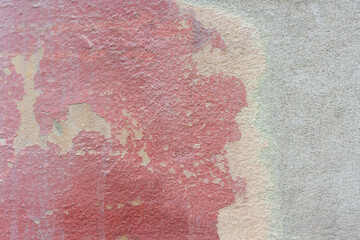 Absctract red and grey wall background. Close-up view of old weathered painted textured concrete wall. Copy space for your text or decorations. Colorful construction material background theme.
