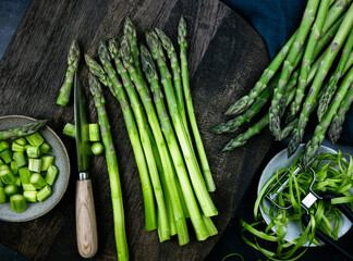 green asparagus on a wooden board