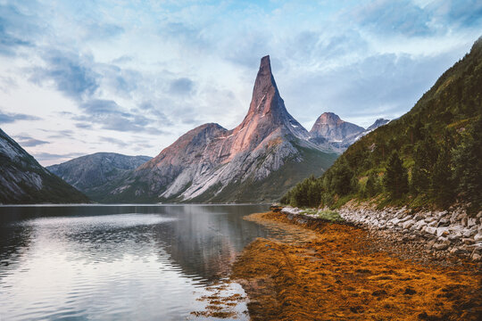 Sunset landscape Stetind national mountain peak in Norway and fjord scenery, travel beautiful sustainable destinations water reflection scandinavian northern nature scenery summer season