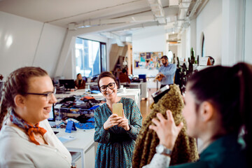 Female team collaborating in a modern fashion design studio