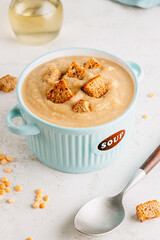 Vegan Yellow split pea soup puree with croutons