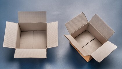 two open cardboard boxes on a blue surface perfect for packaging or moving concepts
