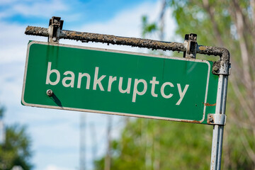 Old Green road sign with the text "bankruptcy"