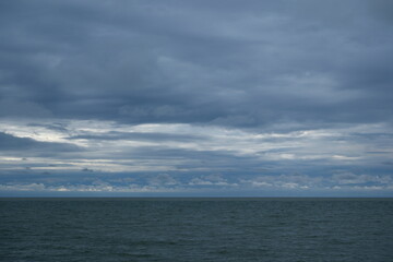 Obraz premium clouds over the sea. Stormy sky over the sea in the evening.