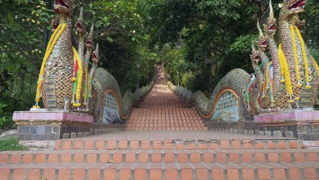 Naga at the stairs of Wat Doi Suthep,a naga is a cobra, This is the most popular temple near Chiang Mai, Thailand slow push in steady