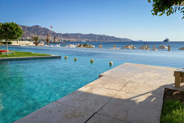Scenic view of swimming pool and Gulf of Aqaba in Aqaba, Jordan