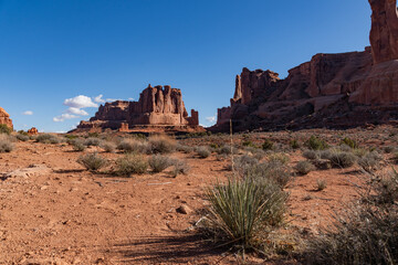 Low angle view of Courthouse Towers on a Spring day with blue skies in Arches National Park 